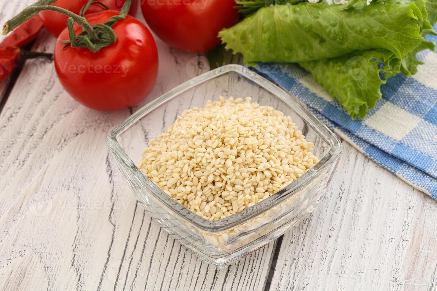 Raw sesame seeds in the bowl photo