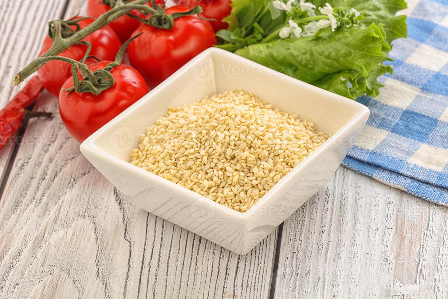 Raw sesame seeds in the bowl photo