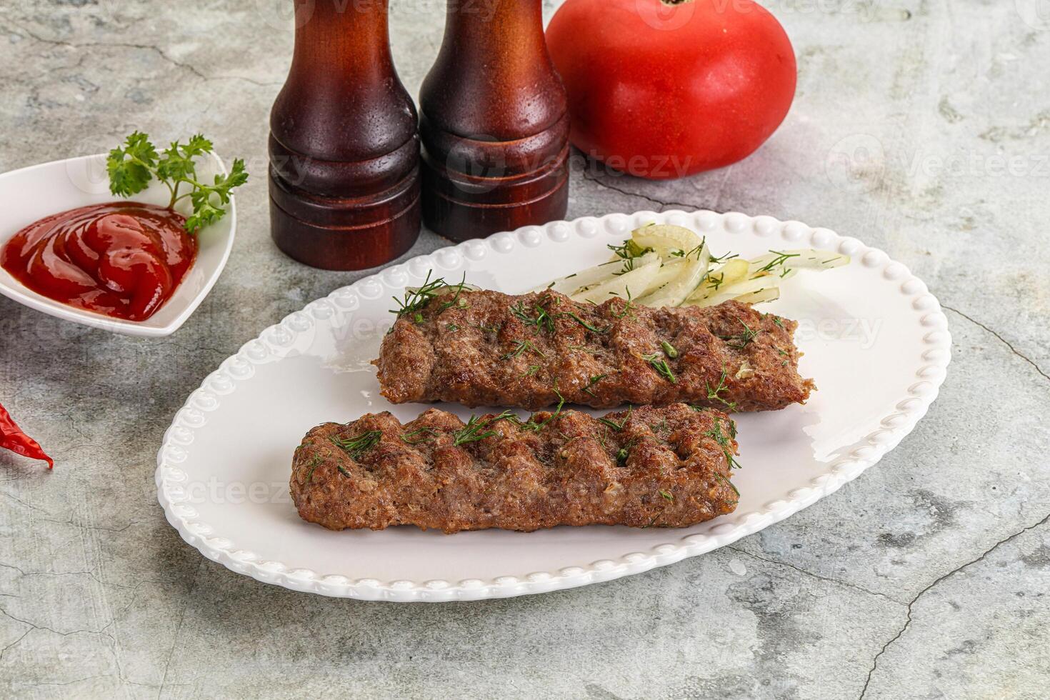 Kebab with beef served onion photo