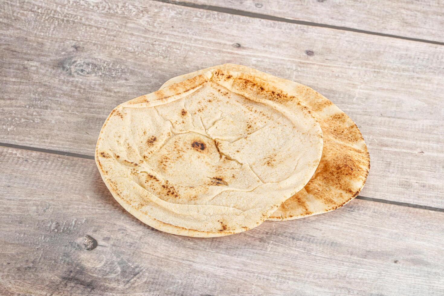 Traditional eastern round pita bread photo