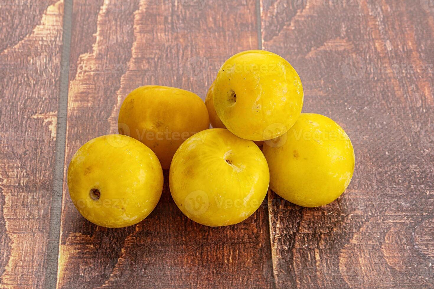 Yellow sweet plum heap fruit photo