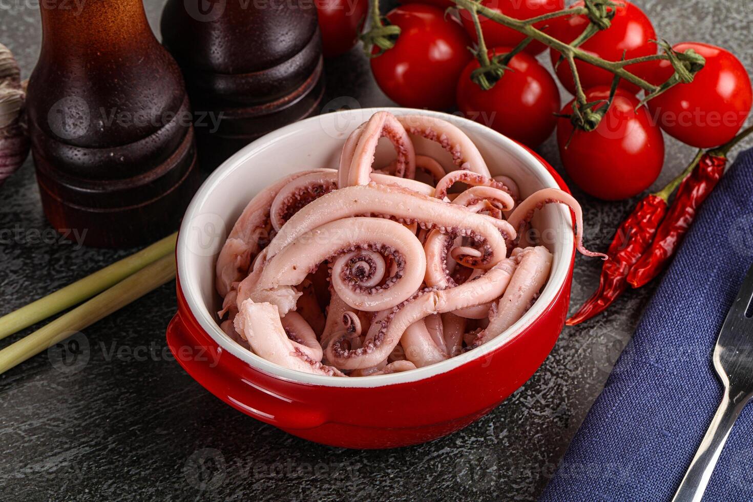 Delicous marinated squid tentacles in the bowl photo