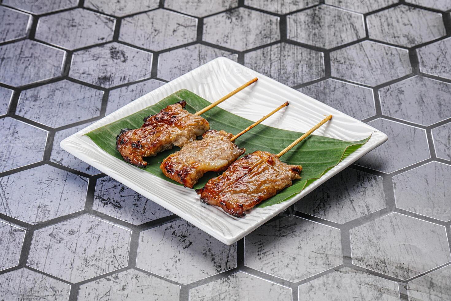 Thai cuisine - grilled pork skewer photo