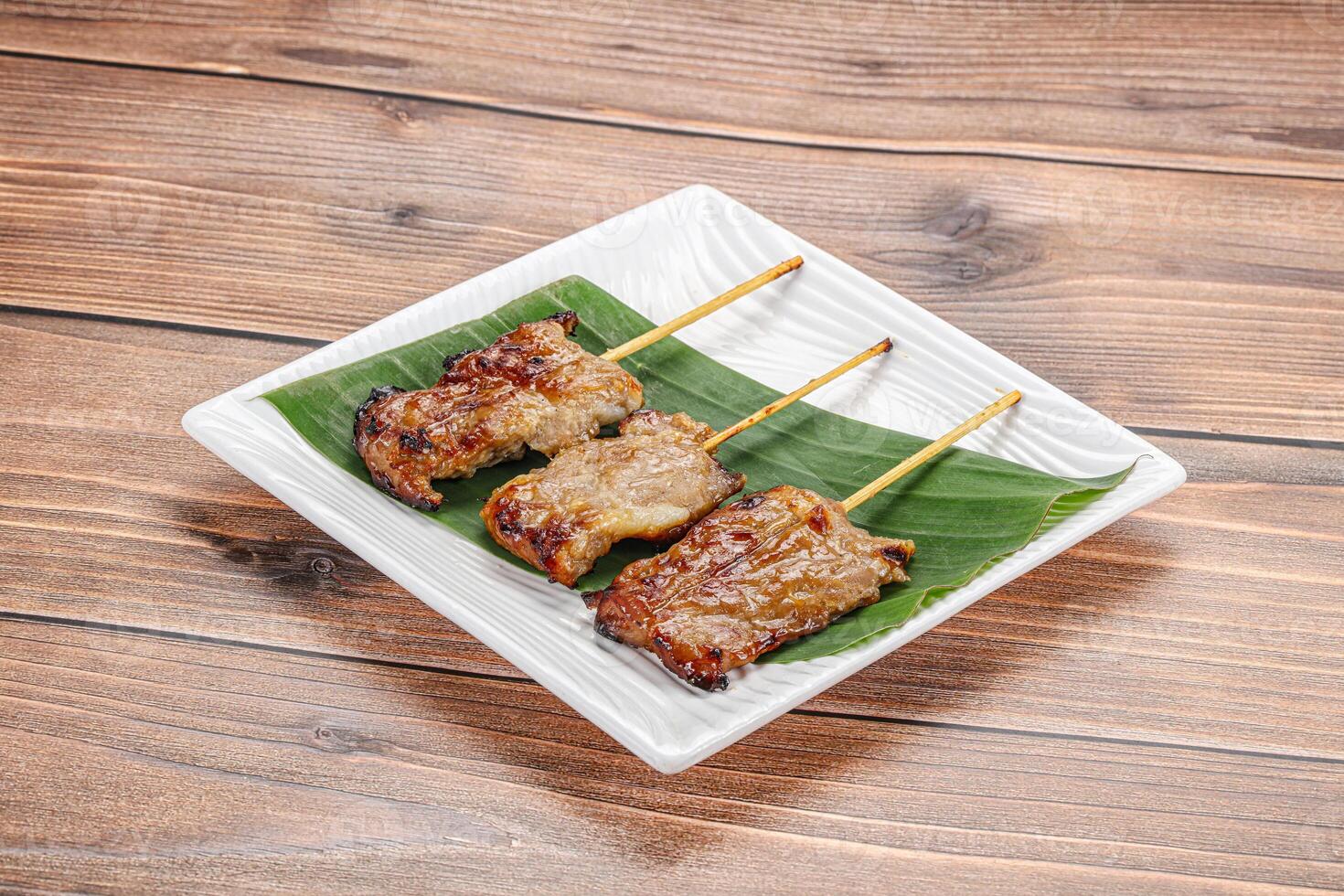 Thai cuisine - grilled pork skewer photo