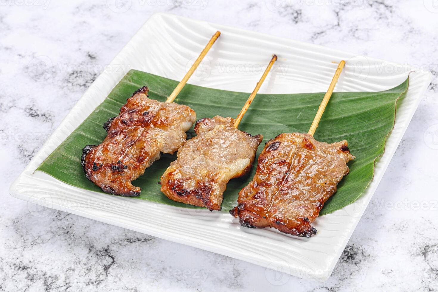 Thai cuisine - grilled pork skewer photo