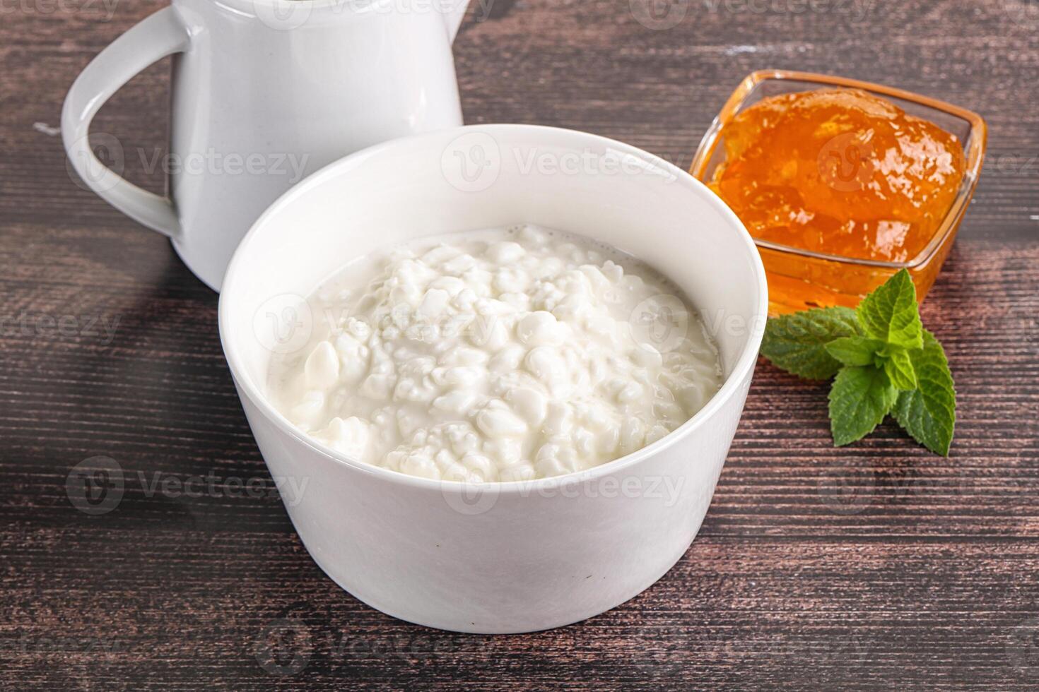 Grain curd with cream and jam photo