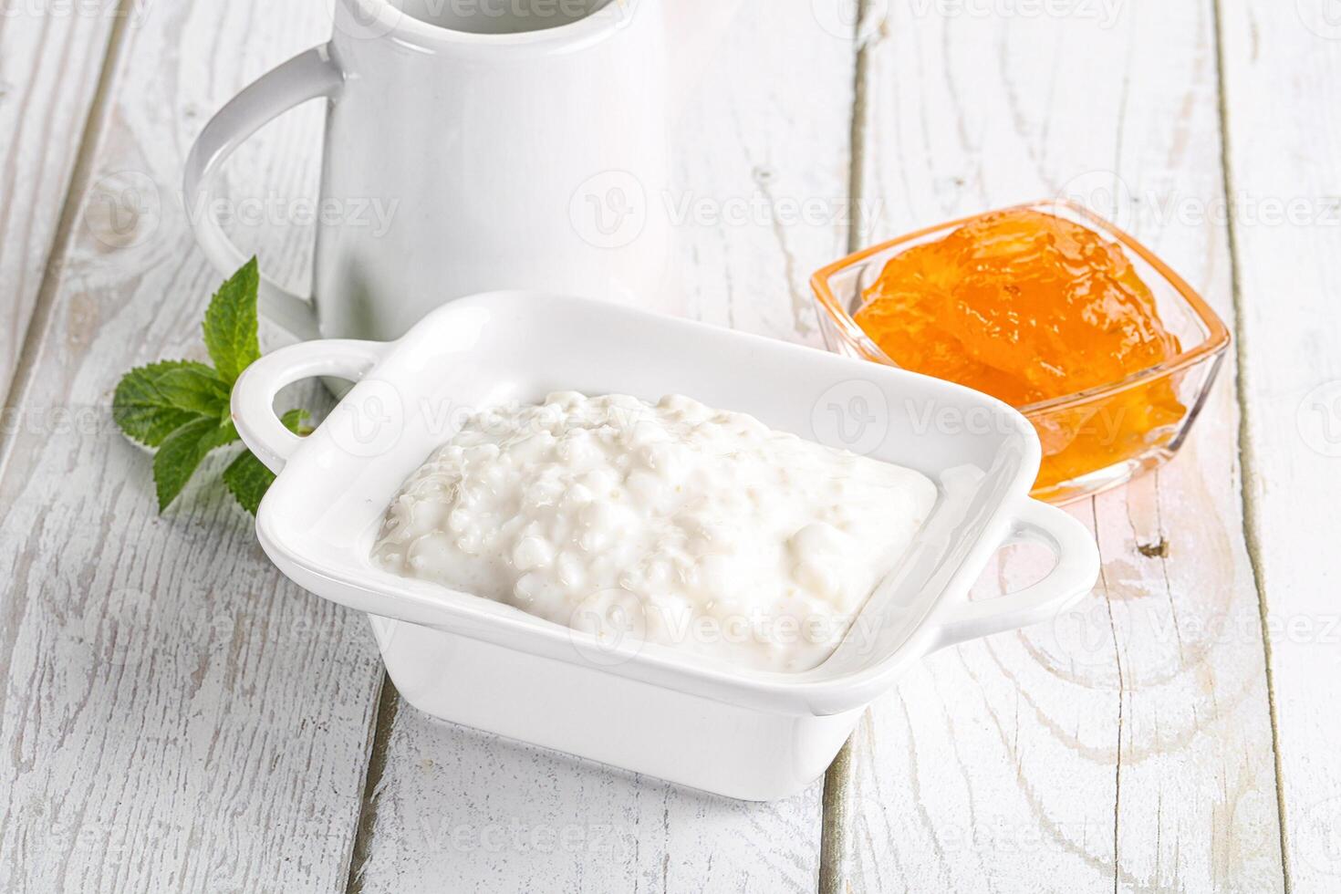 Grain curd with cream and jam photo