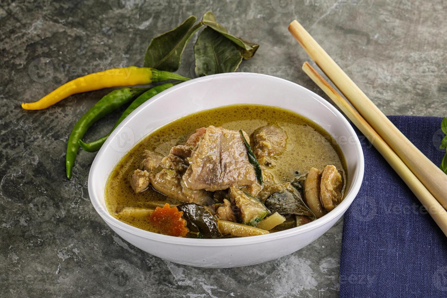 Thai green curry soup with basil photo