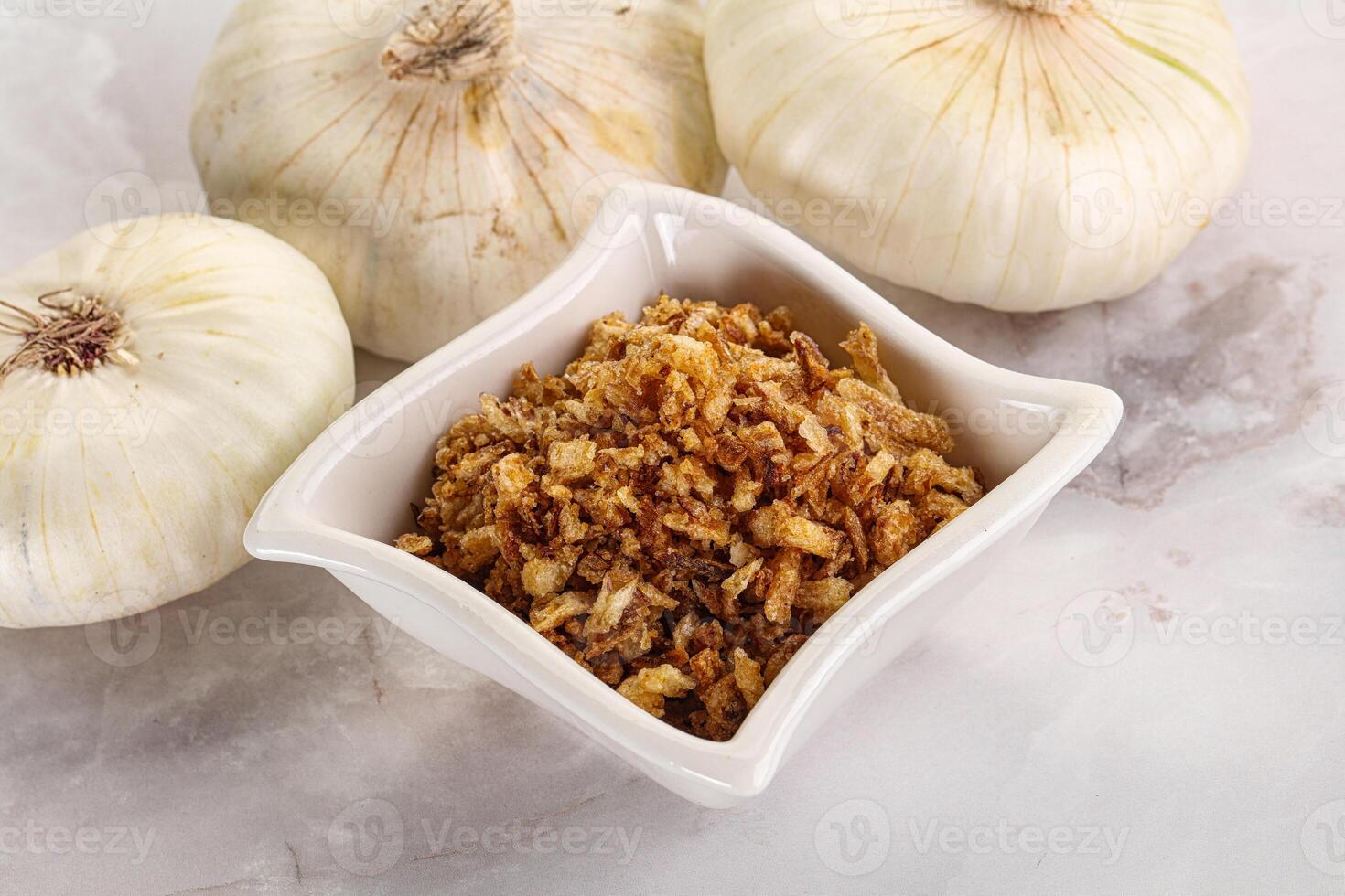 Dried roasted onion flakes for culinary photo