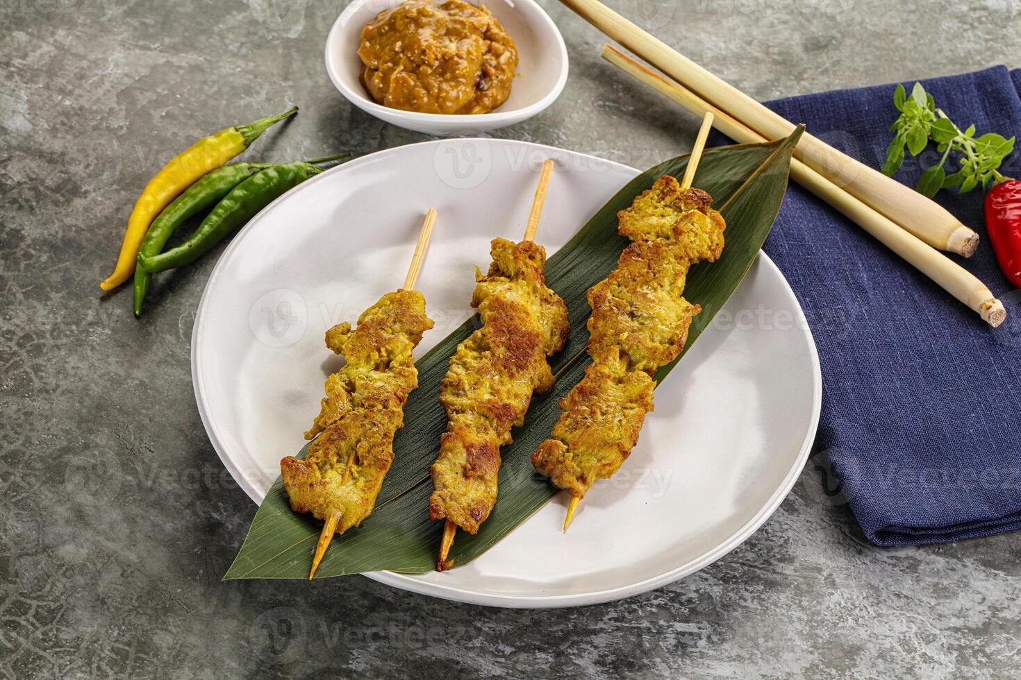 Thai meat skewer Satay with sauce photo