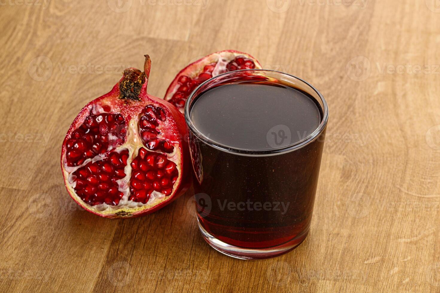 Sweet pomegranate juice in glass photo