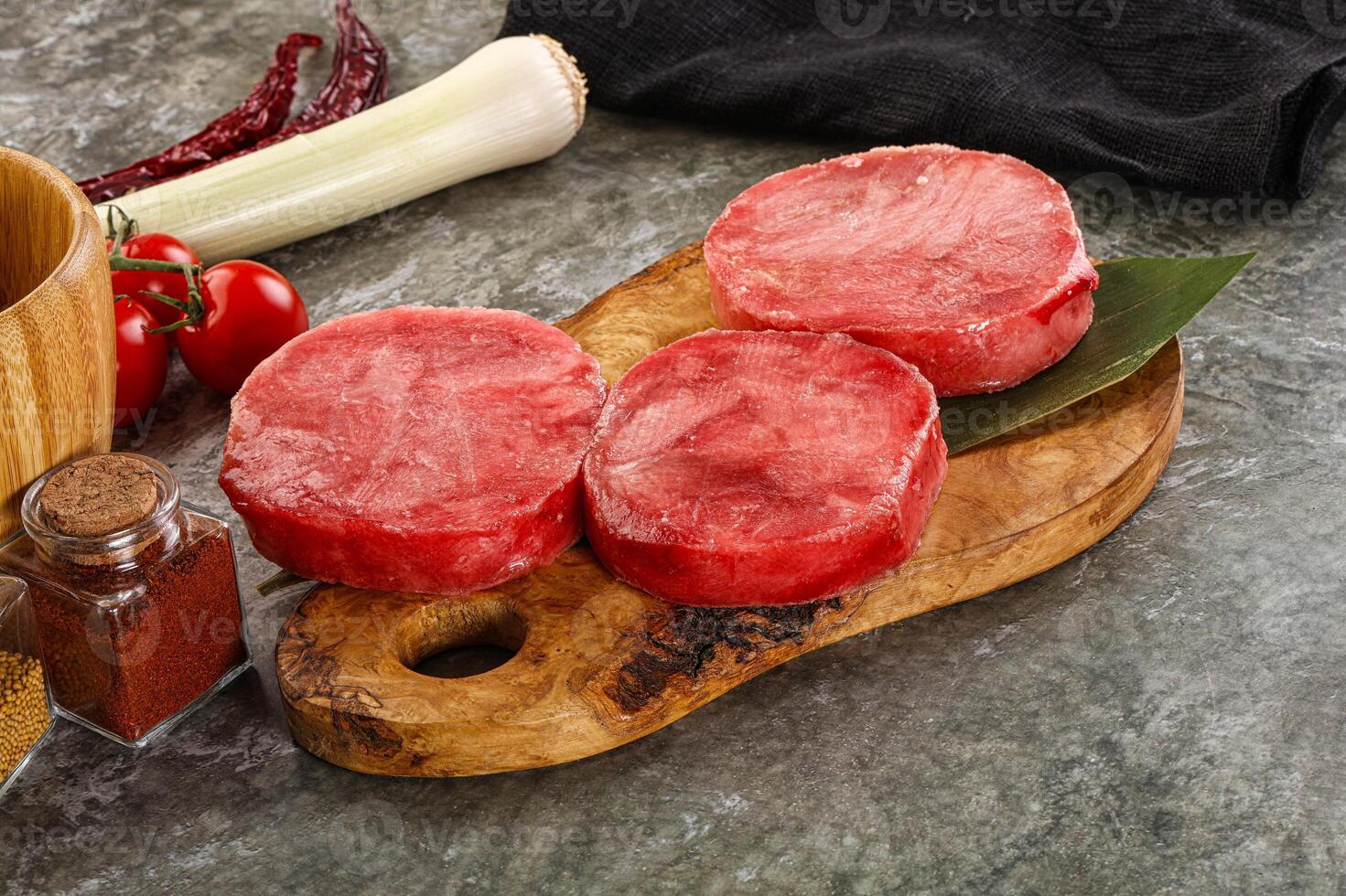 Delicous raw tuna medallion for cooking photo