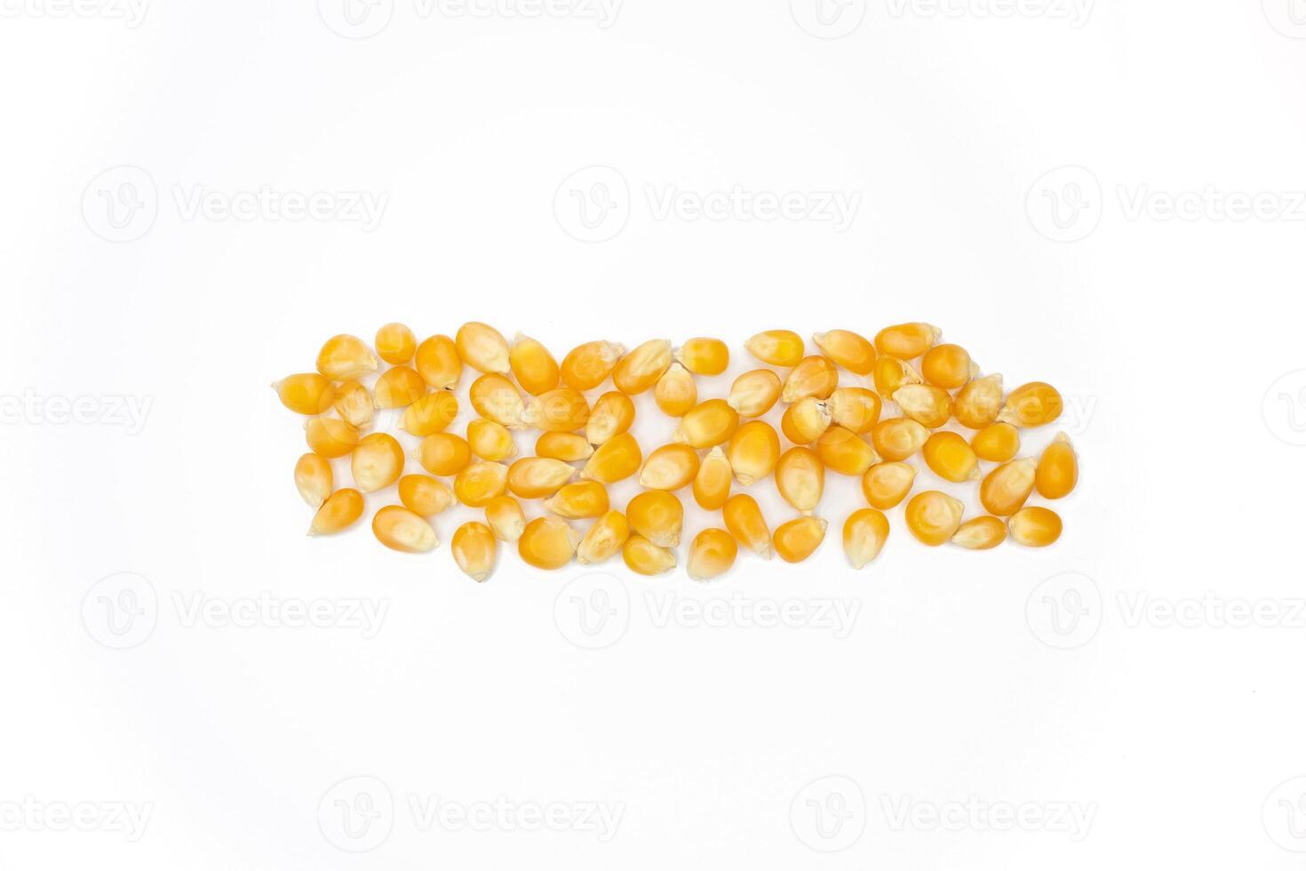 Dried corn kernels isolated on white background. Top view, flat lay. photo