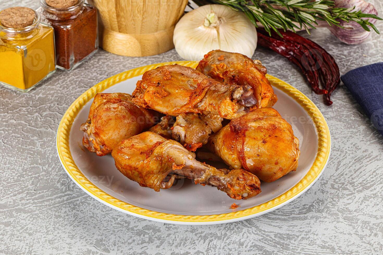 Raw marinated chicken drumstick for cooking photo