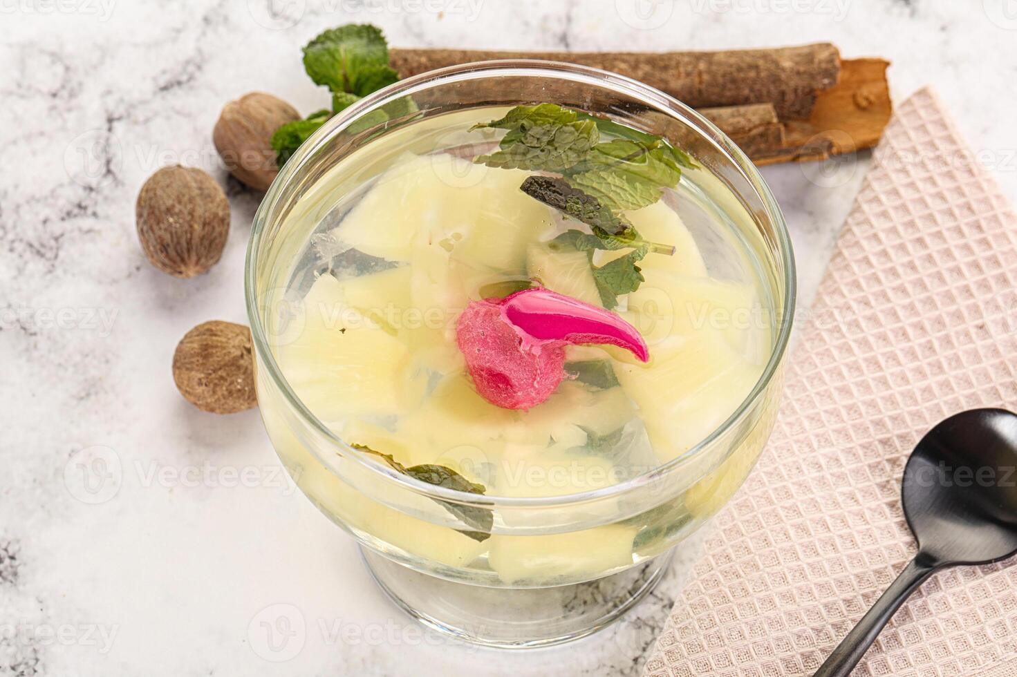 Sweet pineapple jelly with mint photo
