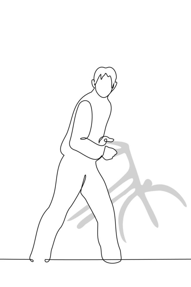 man goes driving behind the wheel of a bike - one line art vector. concept cyclist with bike, on foot, pedestrian, not able to drive a bicycle vector