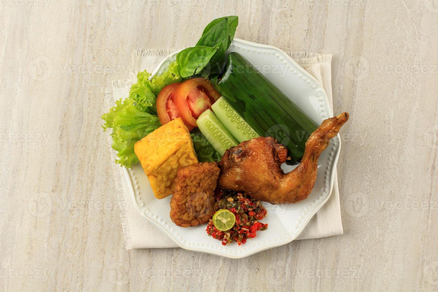Nasi Timbel Komplit, Traditional Sundanese Rice Wrapped with Banana Leaf, photo