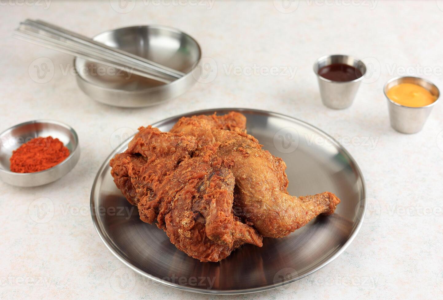 Korean Fried Whole Chicken or Style Market Deep Fried Sijang Tongdak. photo
