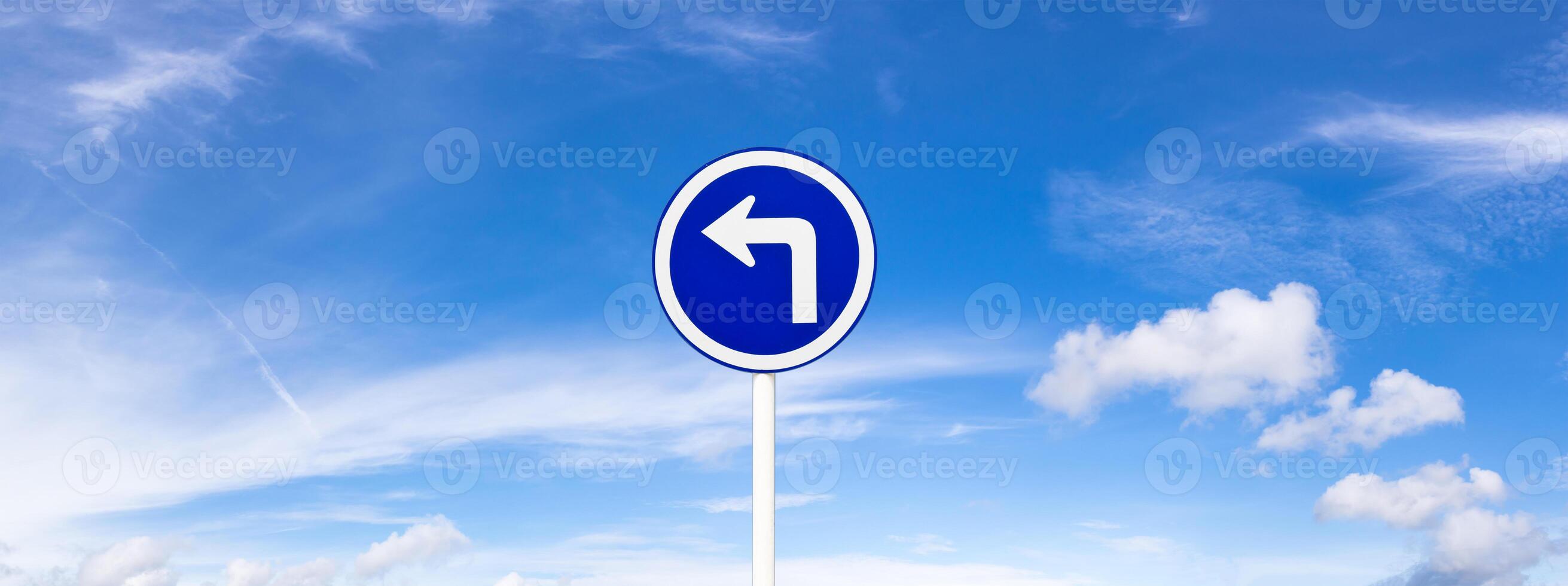 Panoramic blue sky fluffy clouds and road sign photo