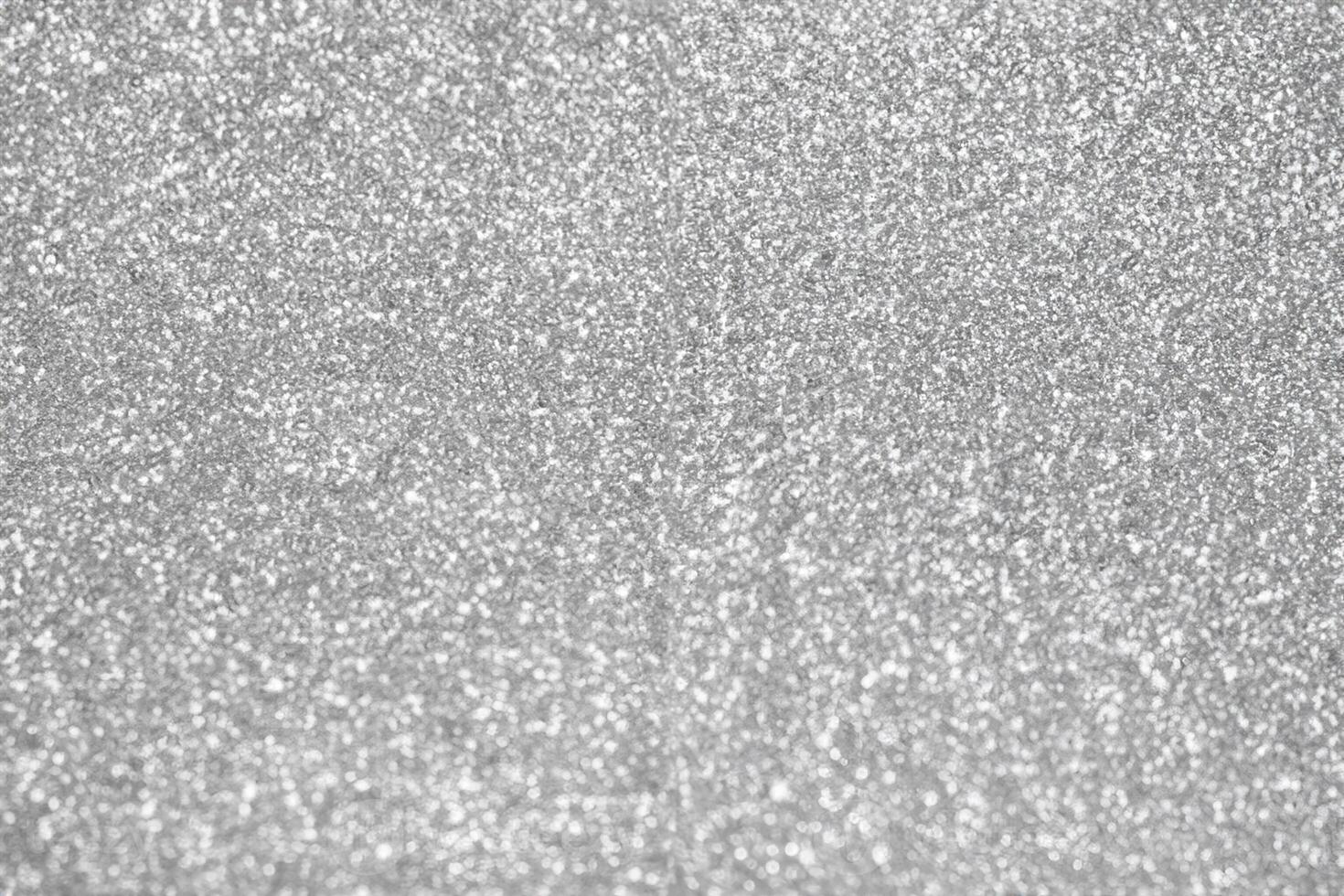 Abstract blur silver glitter sparkle defocused bokeh light background photo