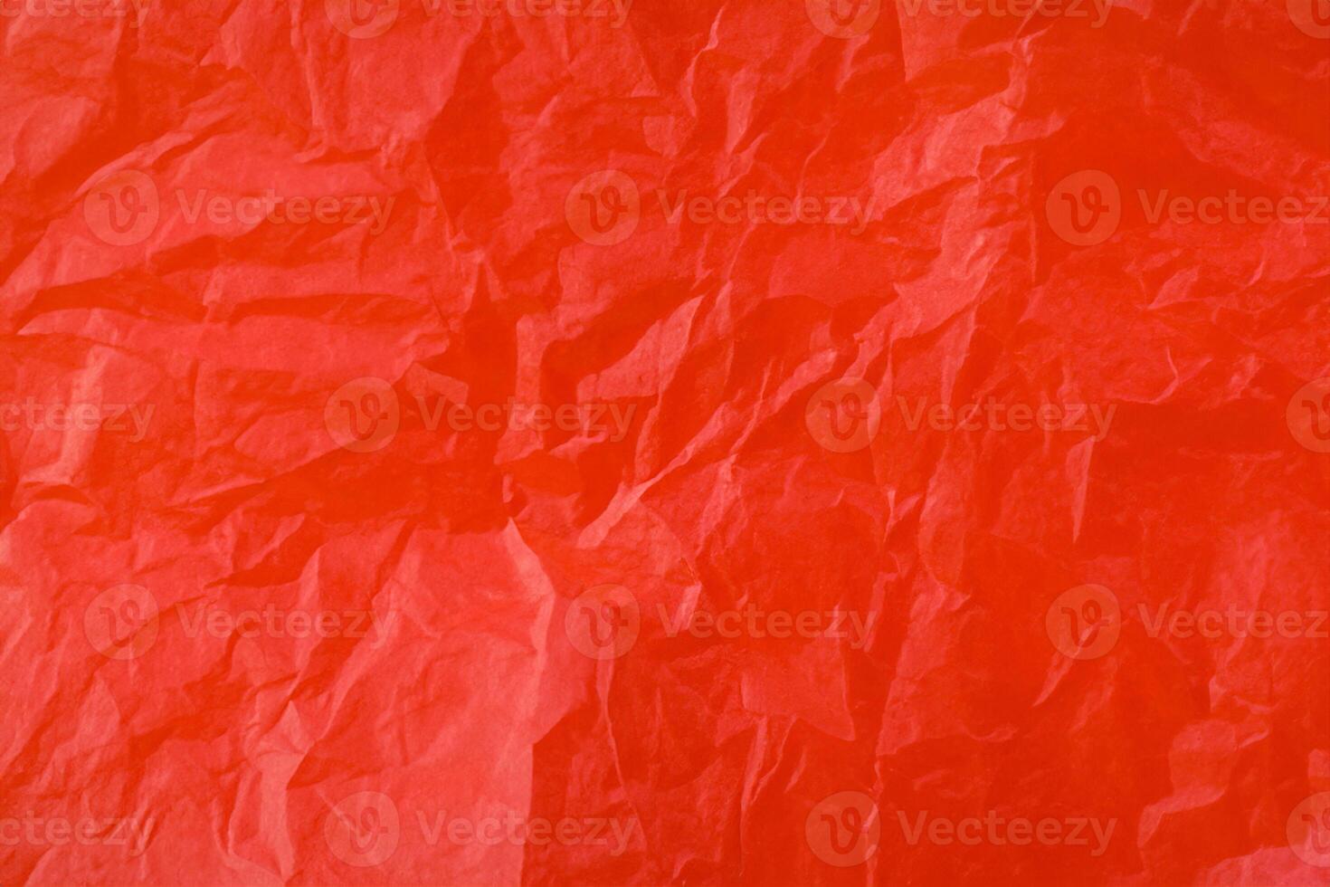 Red crumpled paper texture photo