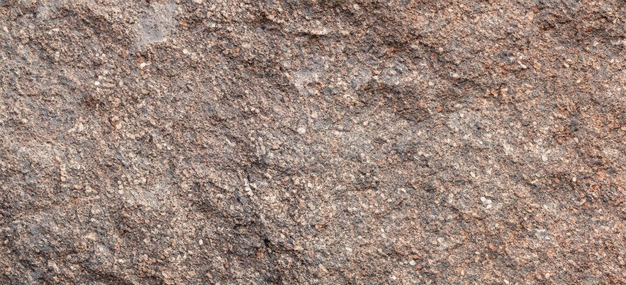 texture of rough granite stone surface background photo