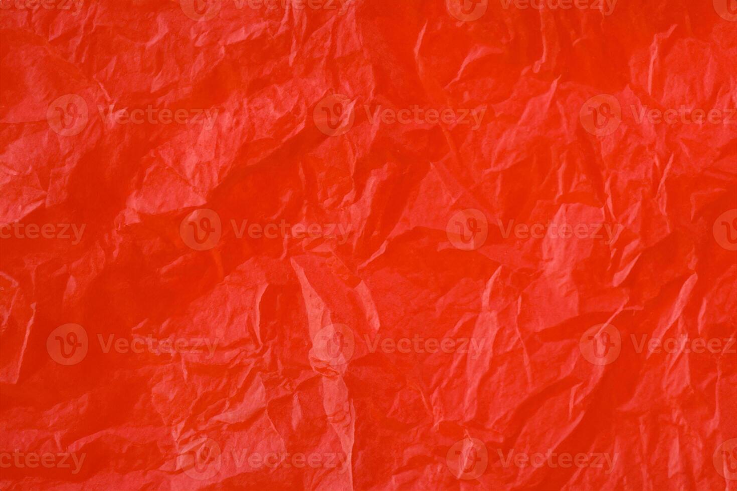 Red crumpled paper texture photo