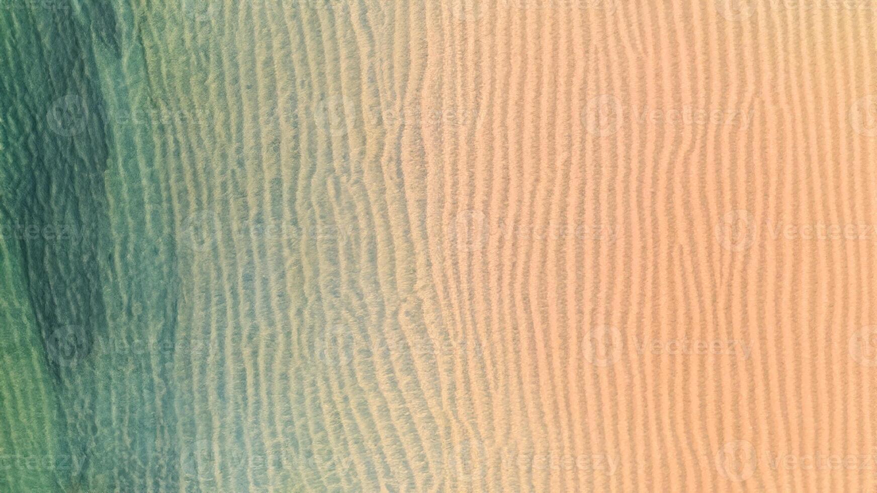 Aerial top view of Beach with shade emerald blue water and wave foam on tropical sea photo