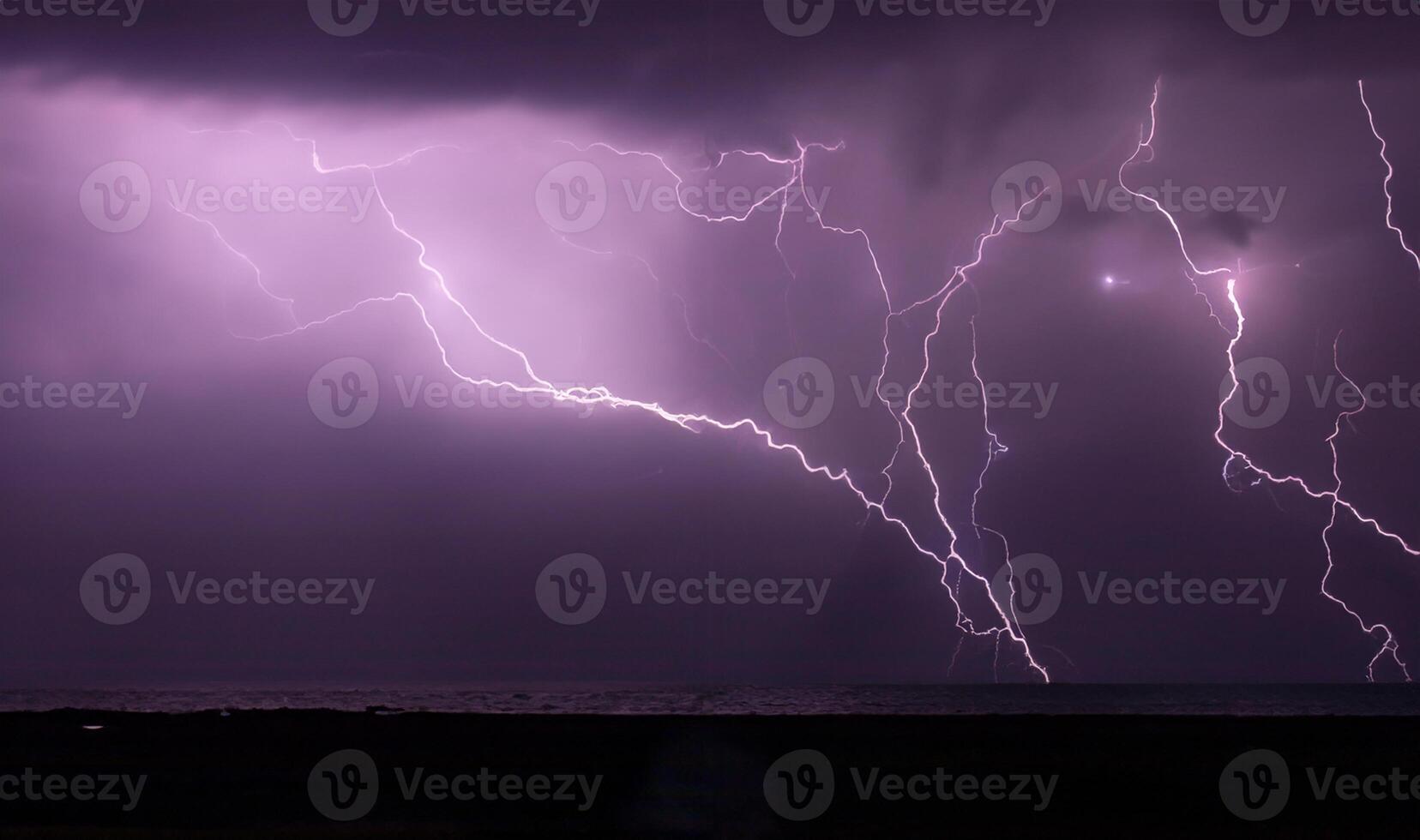 night shooting of a thunderstorm over the sea, photography of lightning photo