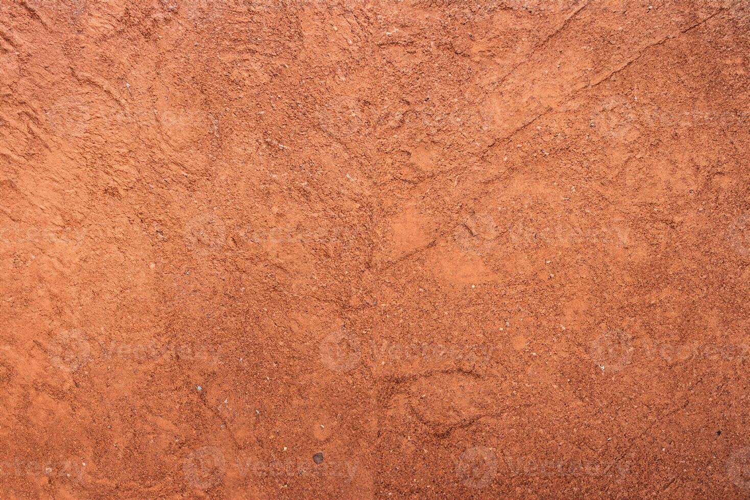 Red sand texture with shoe prints on top photo