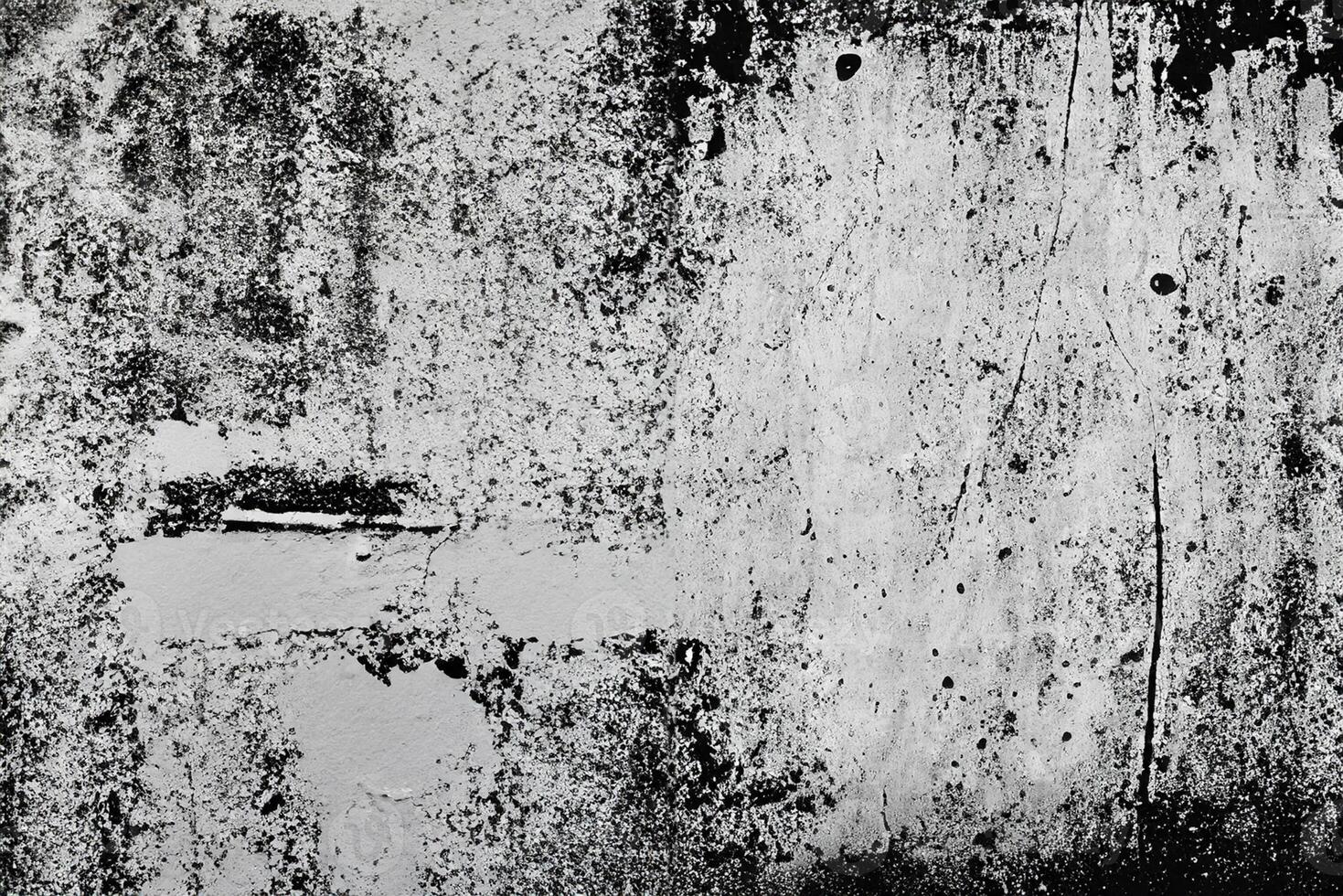 Abstract grunge texture pattern of black paint on white wall photo