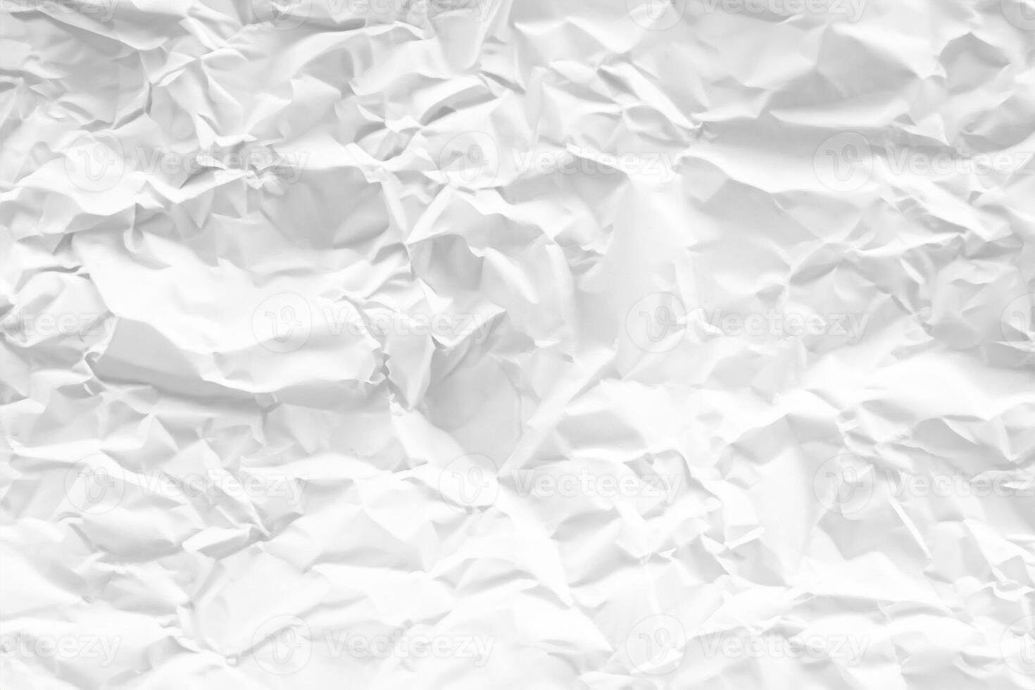 white and gray crumpled paper texture background. crush paper so that it becomes creased and wrinkled. photo