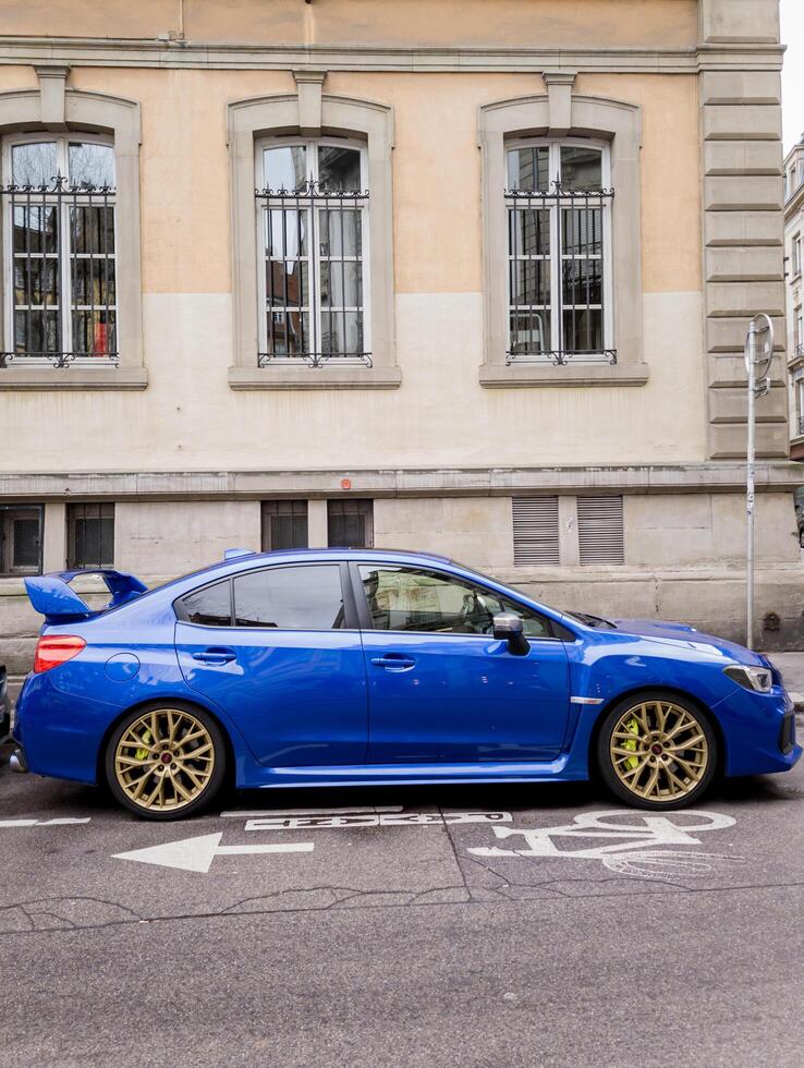 Paris, France, January 06, 2024 - Blue Subaru Impreza sports sedan photo