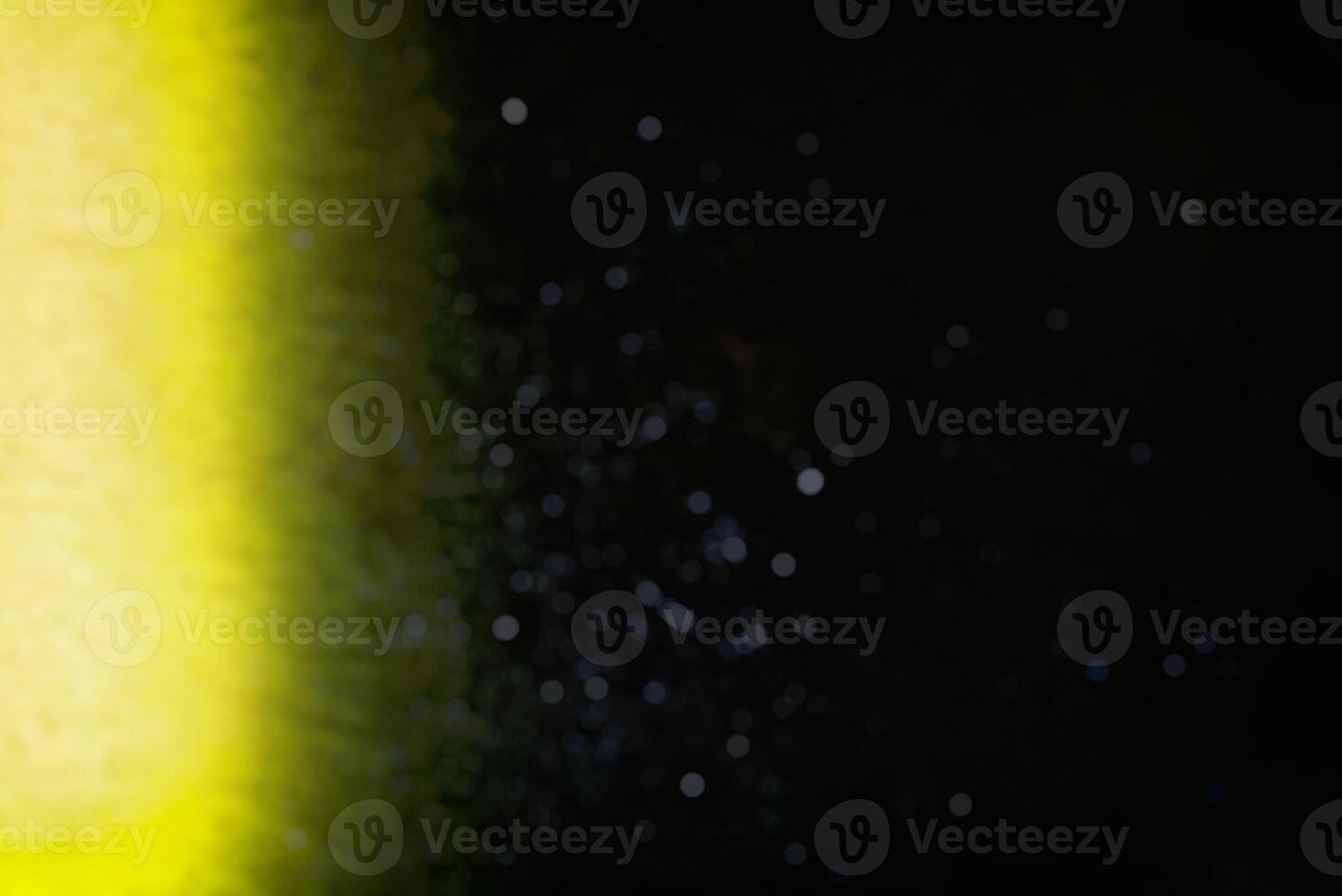 Abstract Blurred Light Beam on Wall with particle Bokeh Background. photo
