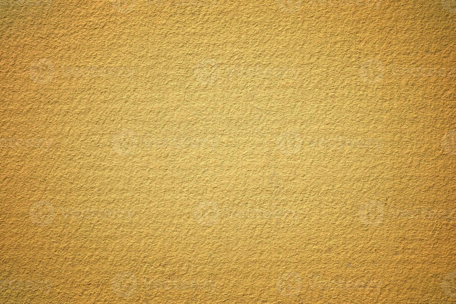 Yellow Painting on Stucco Wall Background. photo