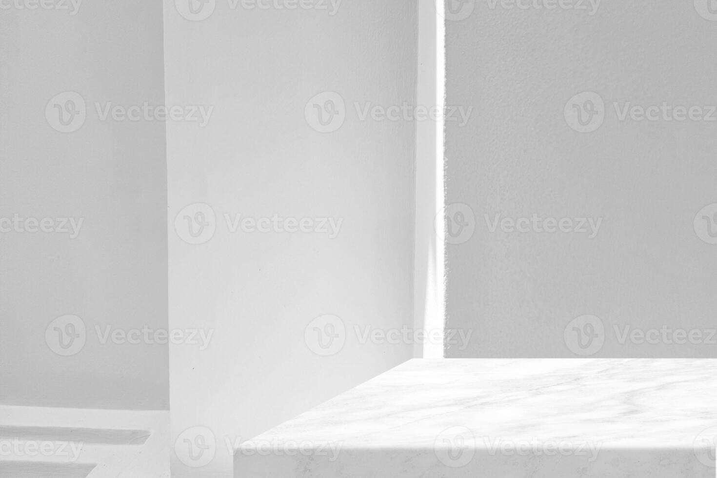 White Marble Table Corner  with White Stucco Wall Texture Background with Light Beam and Shadow, Suitable for Product Presentation Backdrop, Display, and Mock up. photo