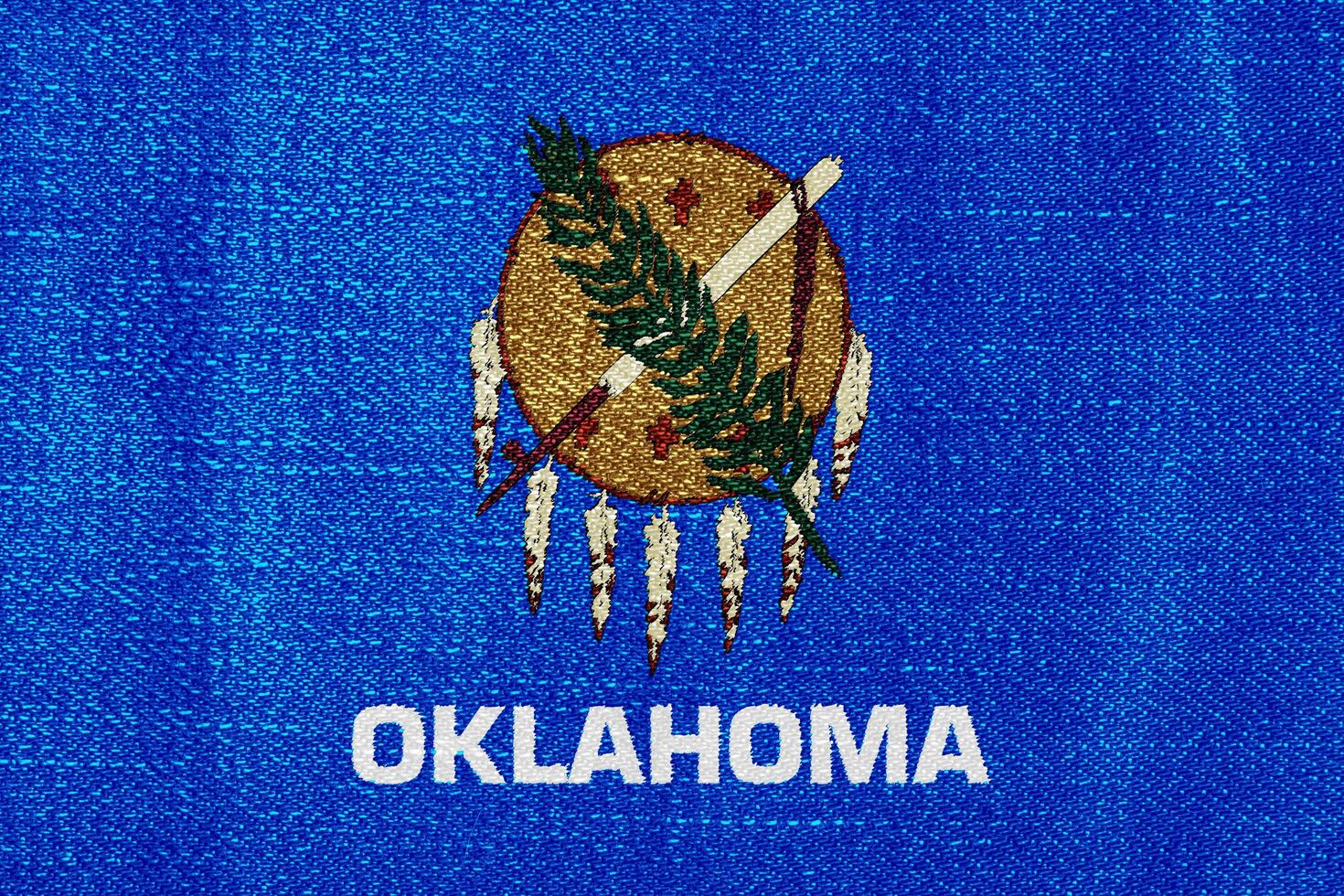 Flag of Oklahoma state USA on a textured background. Concept collage. photo