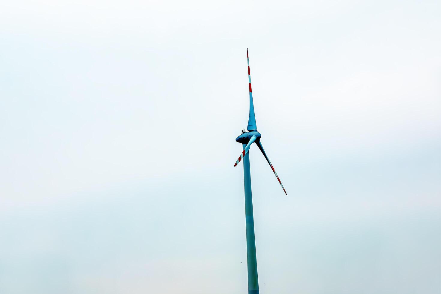 Wind turbine station windmill park next to the road in Austria in cloudy weather. photo
