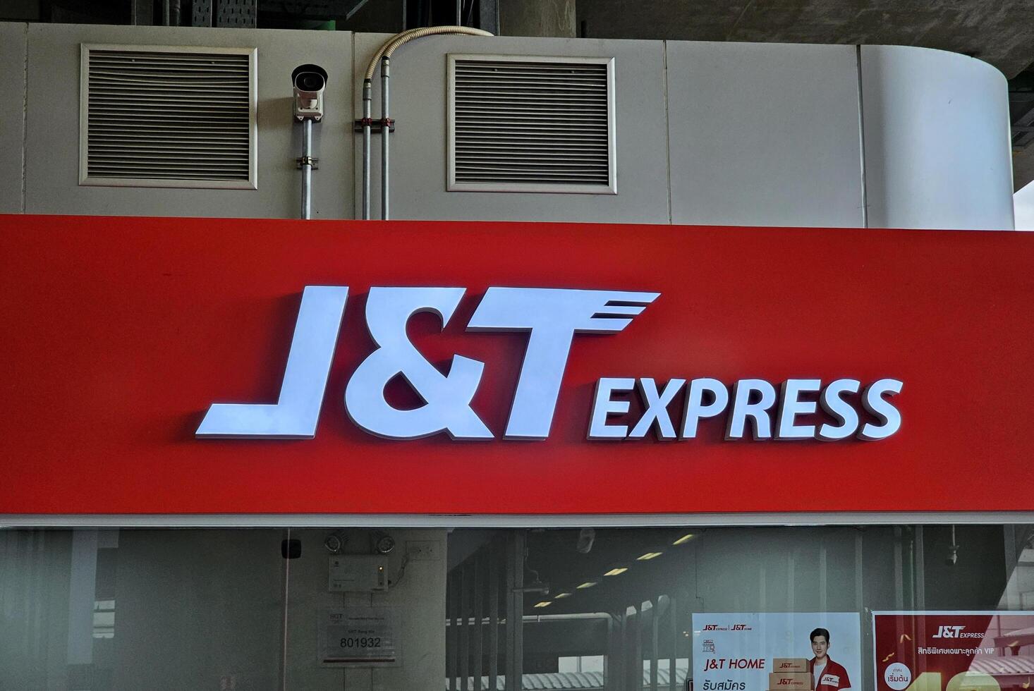 BANGKOK, THAILAND AUGUST 12, 2023 J and T express sign. J and T Express is an international delivery company in Thailand that was founded in August 2015 in Jakarta, Indonesia. photo