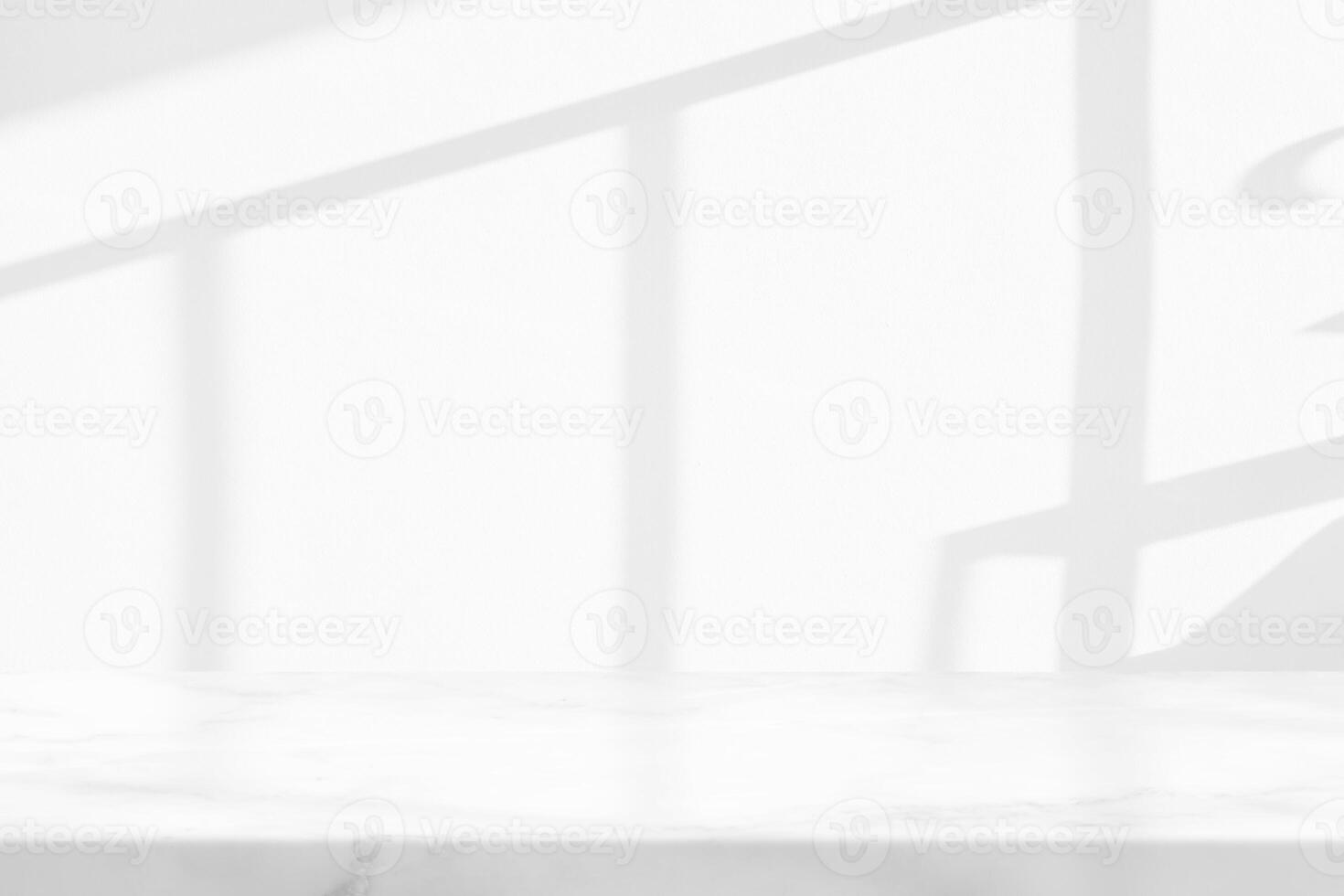 Marble Table with White Stucco Wall Texture Background with Light Beam and Shadow from the Window, Suitable for Product Presentation Backdrop, Display, and Mock up. photo