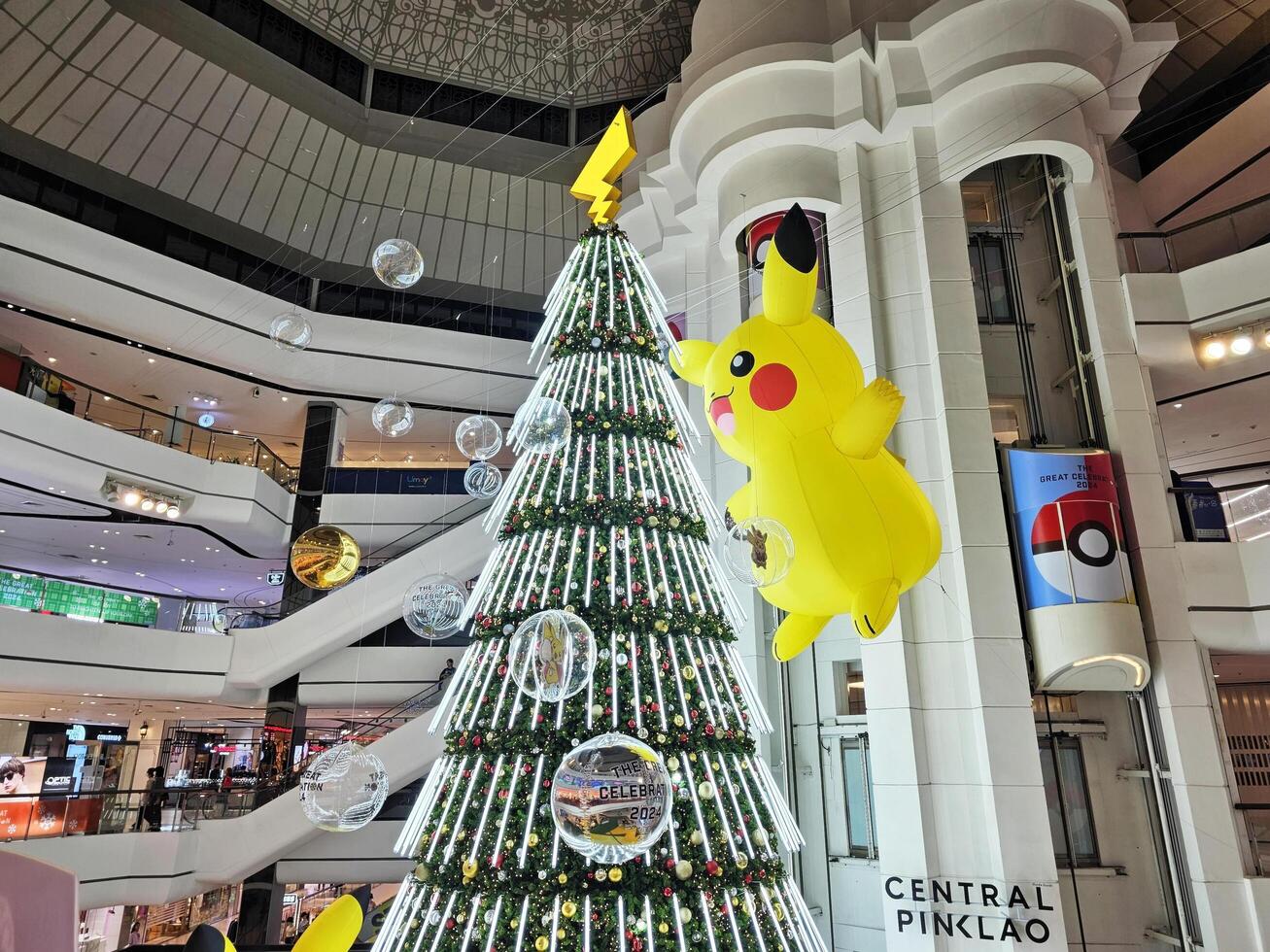 BANGKOK, THAILAND  NOVEMBER 29, 2023 Big Pokemon balloon with christmas tree at Central Pinklao. Pokemon is a Japanese anime that created in 1996 by Ninendo. photo