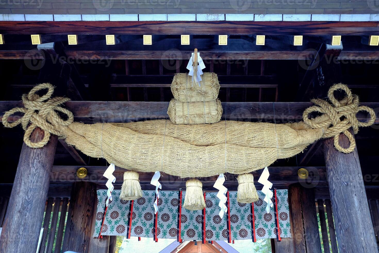Shimenawa Sacred Ropes in front of Hokkaido shrine Mikado where is a tourist attraction in Sapporo, Japan. photo