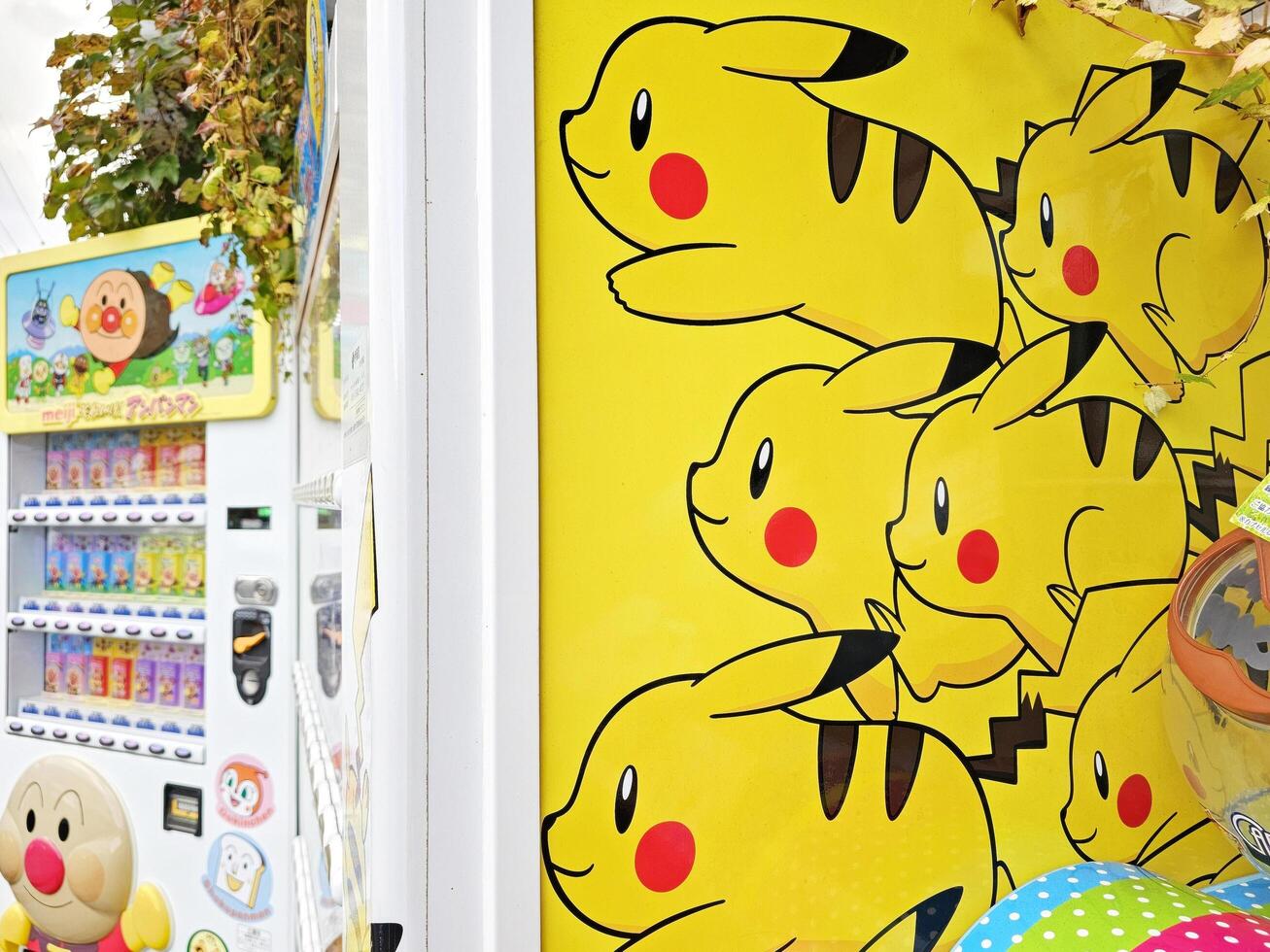 YUFUIN, JAPAN  NOVEMBER 12, 2023 Pokemons on vending machine at Yufuin. Pokemon is a Japanese anime that created in 1996 by Nintendo. photo