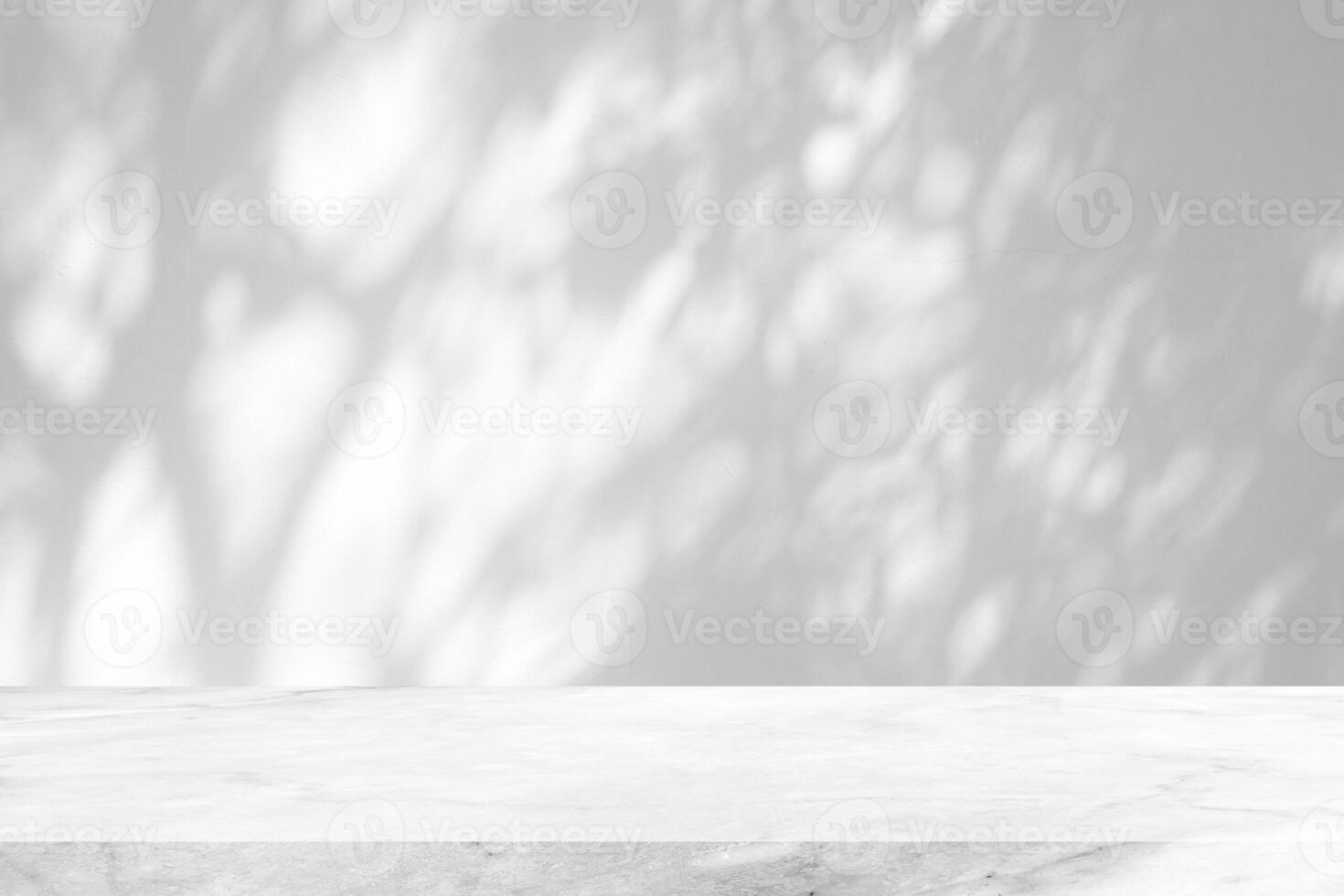 White Marble Table with Tree Shadow on Concrete Wall Texture Background, Suitable for Product Presentation Backdrop, Display, and Mock up. photo