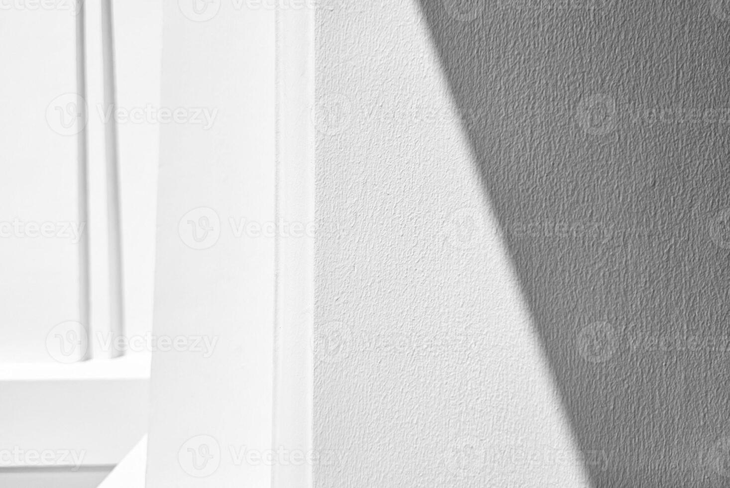 White Stucco Wall with Natural Light and Shadow Background. photo