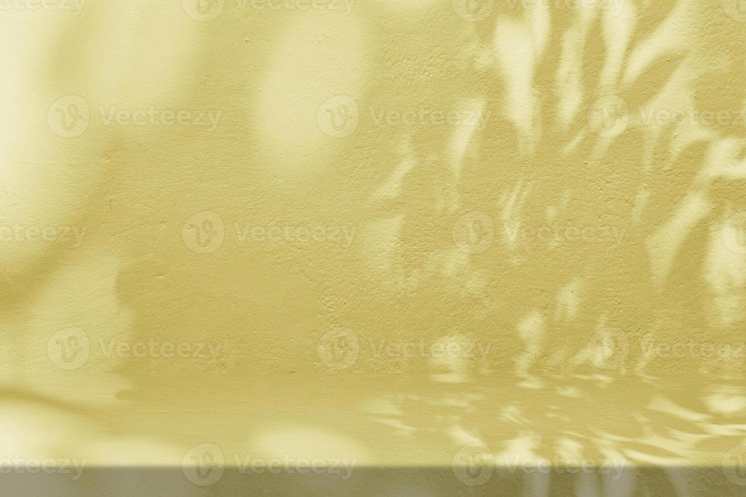 Gold Stucco Table with Nature Shadow on Concrete Wall Texture Background, Suitable for Cosmetic Product Presentation Backdrop, Display, and Mock up. photo