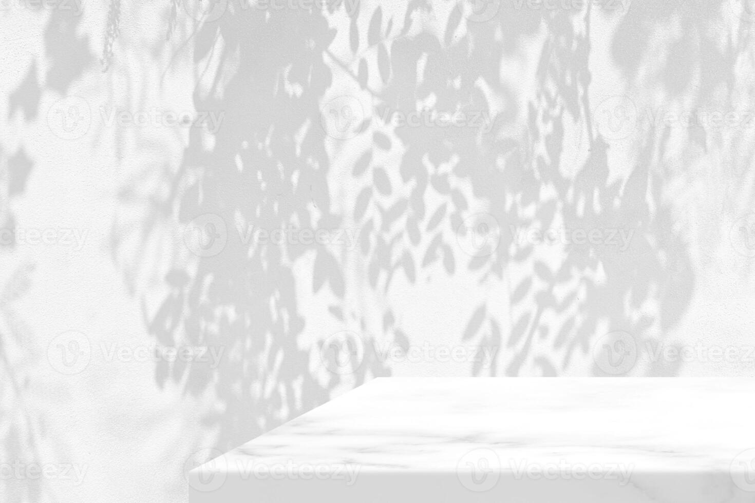 White Marble Table with Leave Shadow on Concrete Wall Texture Background, Suitable for Product Presentation Backdrop, Display, and Mock up. photo