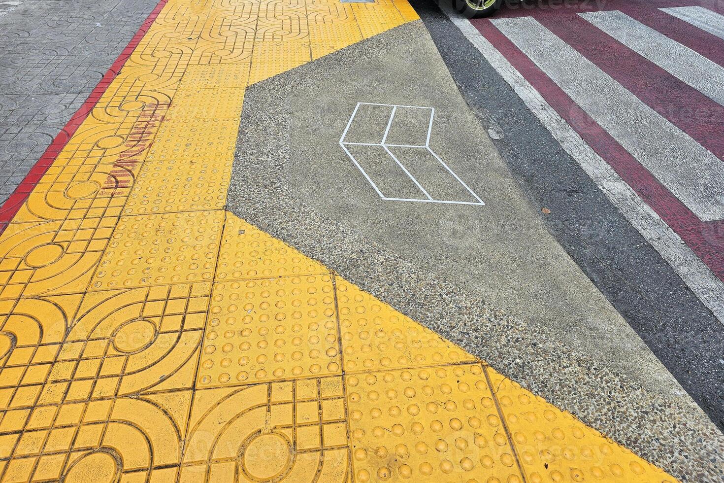 Wheelchair Sloped Curb Ramp from Pedestrian Crossing to Footpath. photo