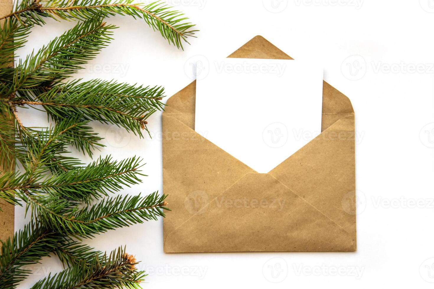 Greeting card in a craft envelope on a white background with space for text. photo