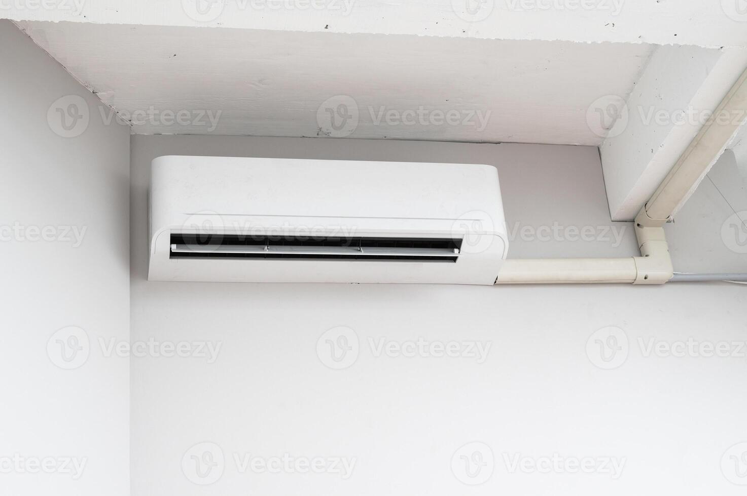 air conditioning system. pure indoor climate. With advanced technology and energy efficient operation, white room wall mounted unit ensures optimal temperature and ventilation. photo